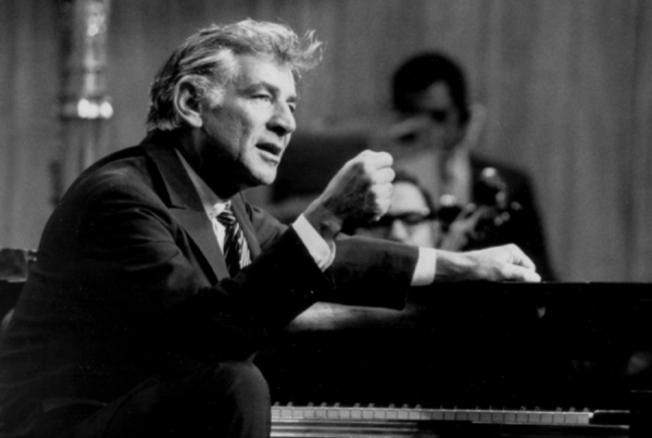 Leonard Bernstein talking at the piano