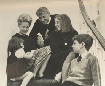 A group of people sitting on a staircase