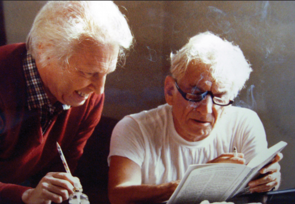 Hans Weber and Leonard Bernstein review a score. Courtesy of the Library of Congress.