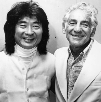 Black and white photo of two men standing and smiling