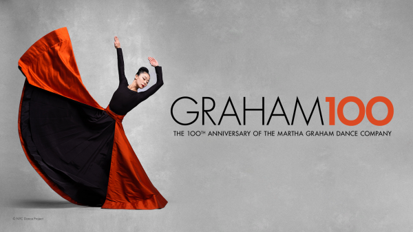 A dancer in a long black dress with a flowing red skirt dramatically extended in motion, arms raised in a graceful pose, set against a gray background. Beside her, bold text reads GRAHAM100 – The 100th Anniversary of the Martha Graham Dance Company