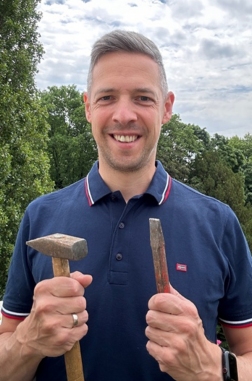 Franz Kranke as an adult with the same hammer and chisel Leonard Bernstein used in 1989.